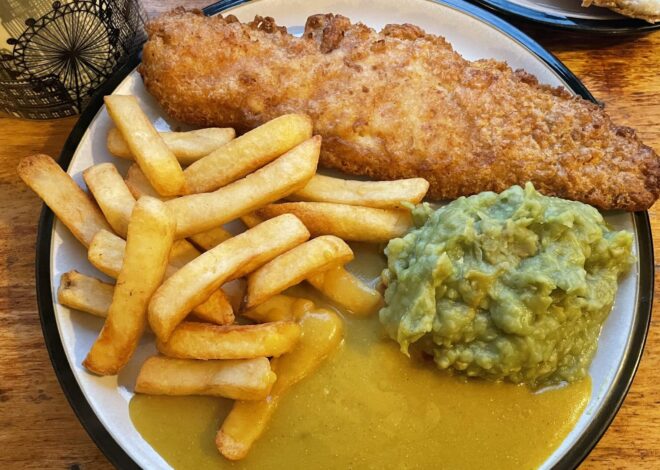 Savoring the Classic: A Dive into Fish ‘N’ Chips with a Twist of Curry and Peas