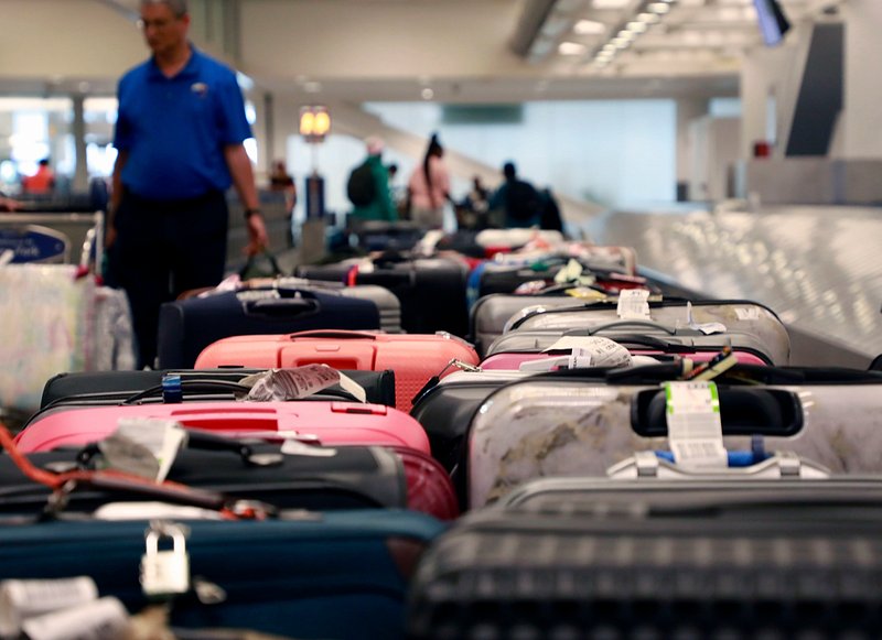 sky-high debate airlines charge carry-ons checked bags