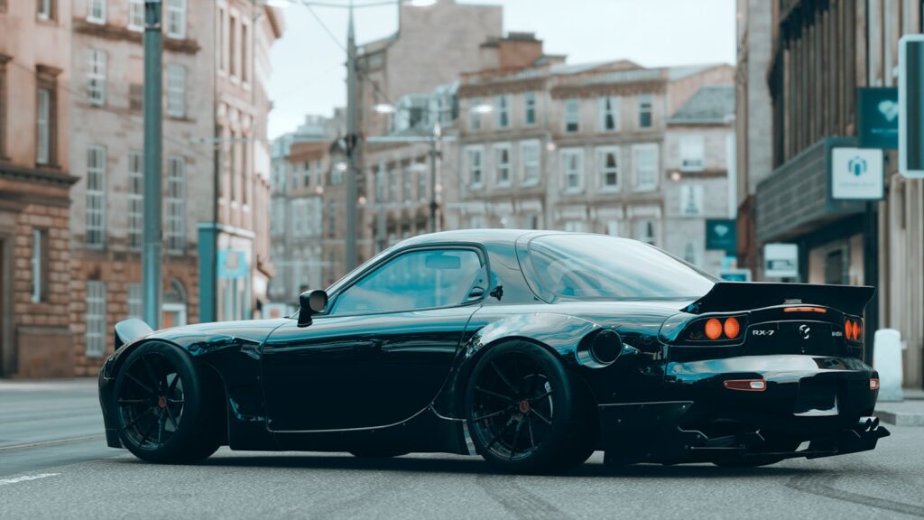 A Black Mazda Car Parked on Street