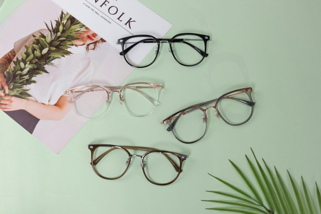 Three pairs of glasses sitting on top of a table